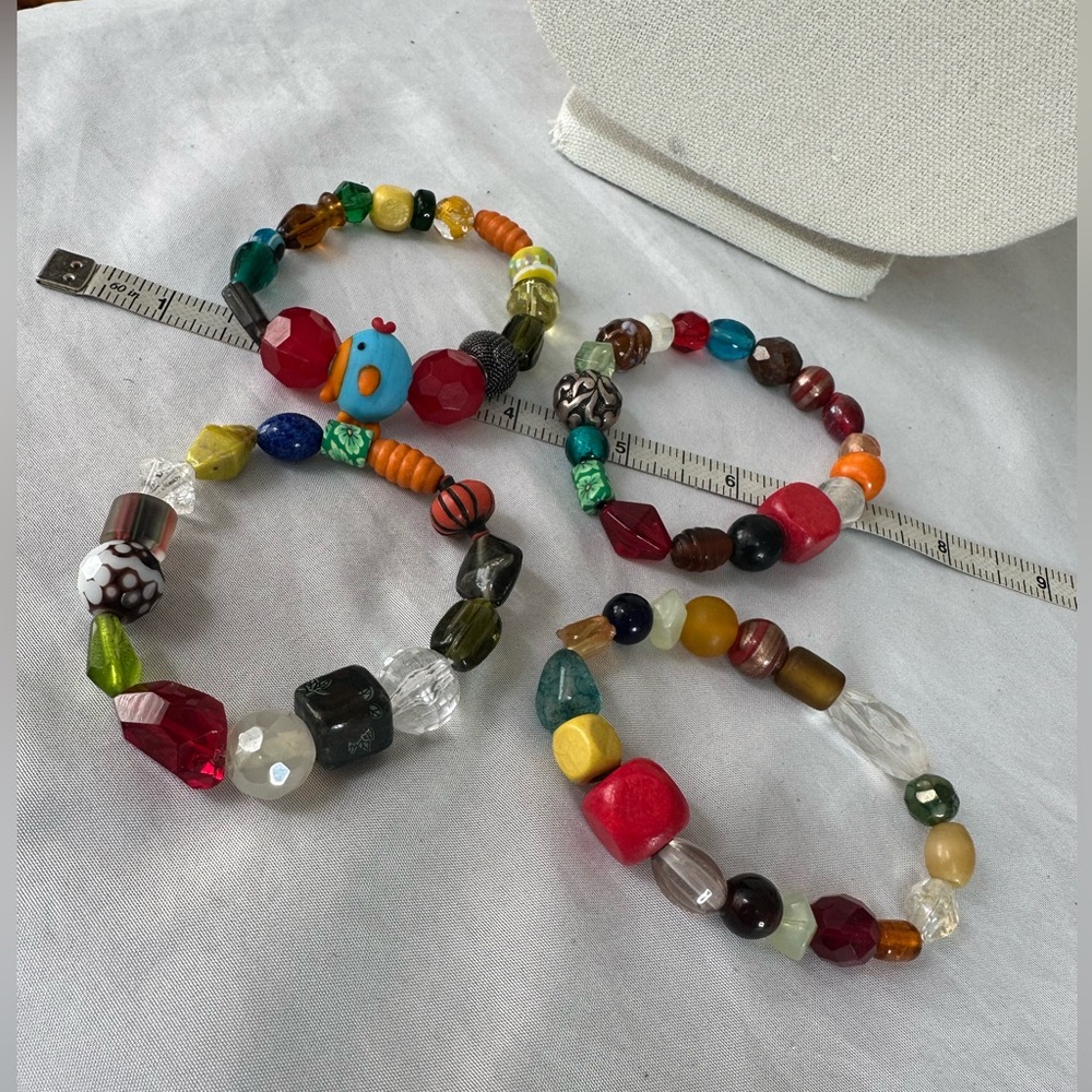 Four Multi Colored Stretch Bead Bracelets - image 1